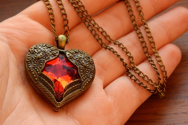 necklace with winged heart, heart in hand, winged heart
