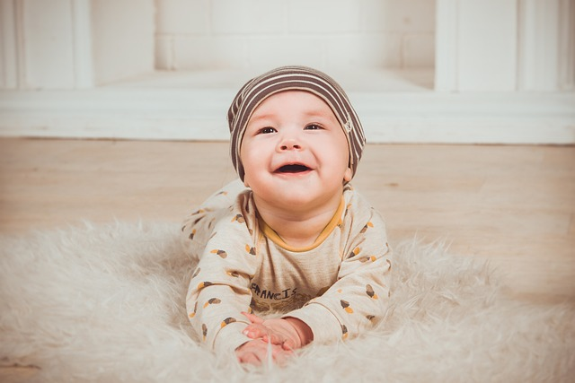 baby bending over looking through legs